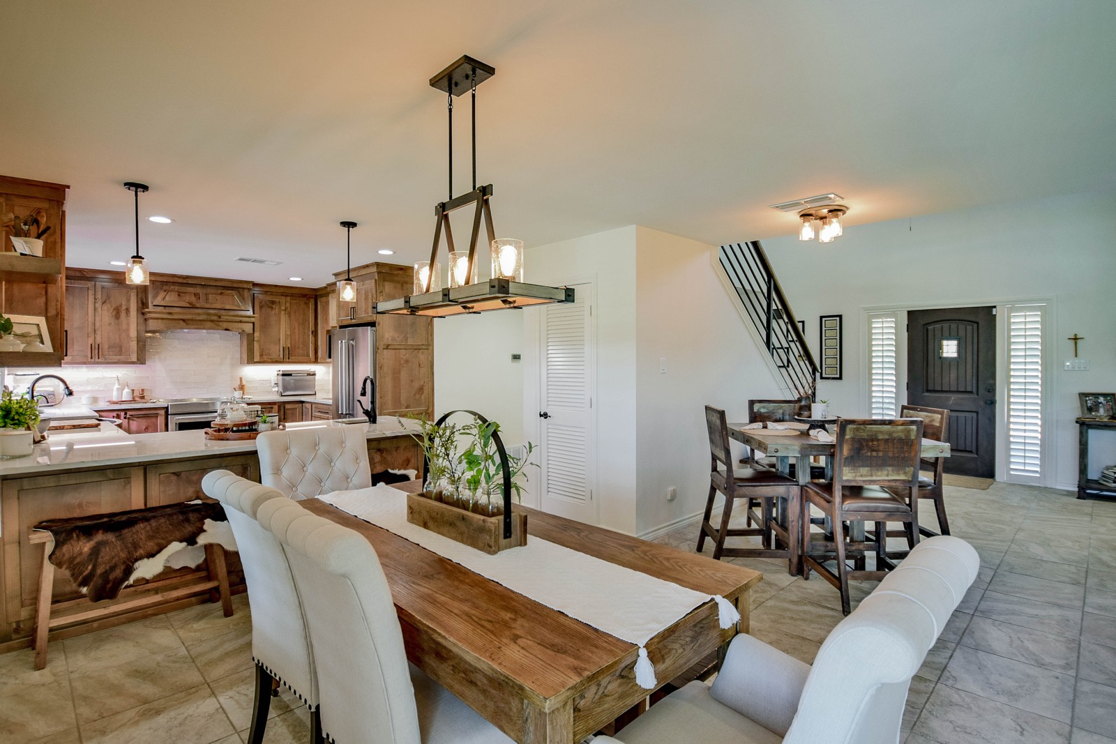 Remodeled kitchen and dining with knotty alder cabinets and quartz counters
