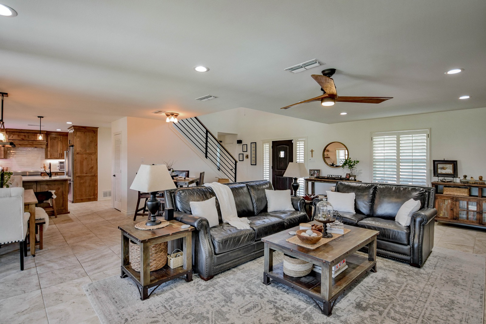 Wide view of living room showing open plan through to kitchen